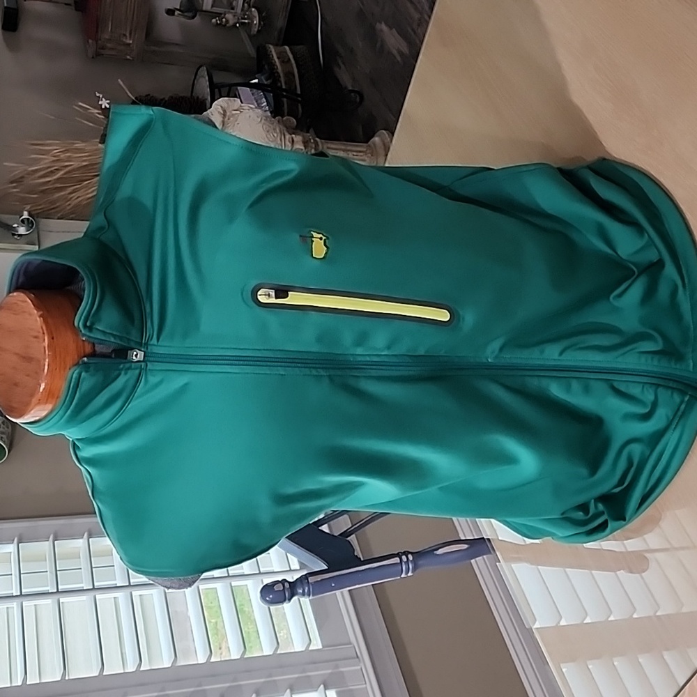 Masters sleeveless golf vest with 2 side pockets and one pocket on left chest